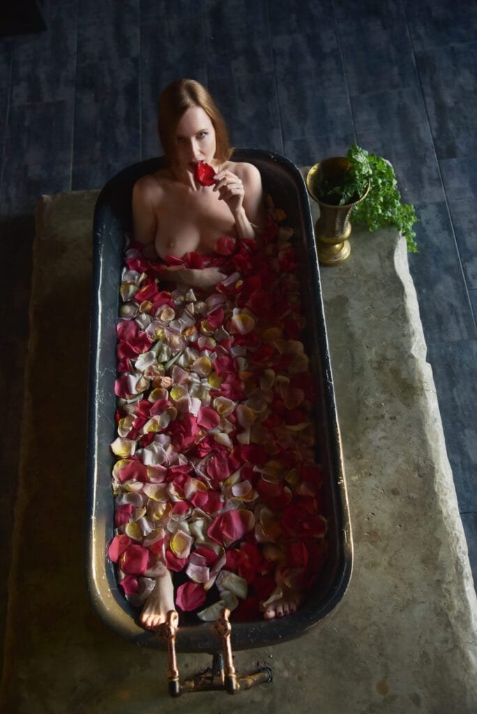 A timeless nude portrait captured in an antique bathtub