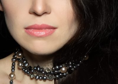 elegant-woman-wearing-pearl-necklace-and-makeup-2026-03-25-23-48-21-utc